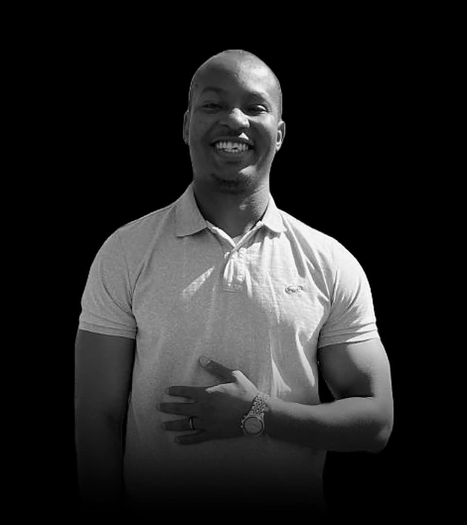 Portrait of Chukwuemeka Iheonye, smiling, in a polo shirt